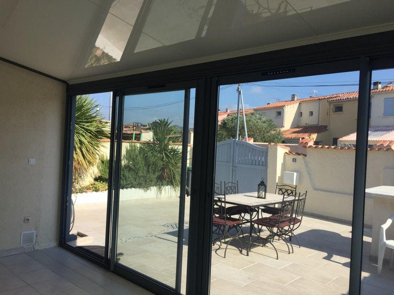 Véranda avec porte coulissante sur Châteauneuf-les-Martigues